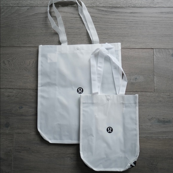 lululemon athletica Handbags - Lululemon small and large white shopping tote bag bundle